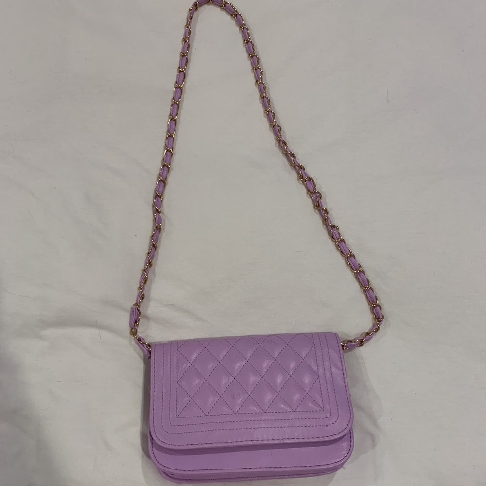 lavender color purse with shoulder strap
